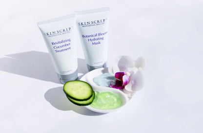 Two Skinscript skincare products with cucumber slices and a bowl of green gel on a white background